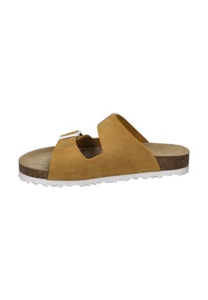 Tan suede slide sandal with open toe and cut-out design. White rubber sole, textured cork footbed, and dual adjustable buckles.