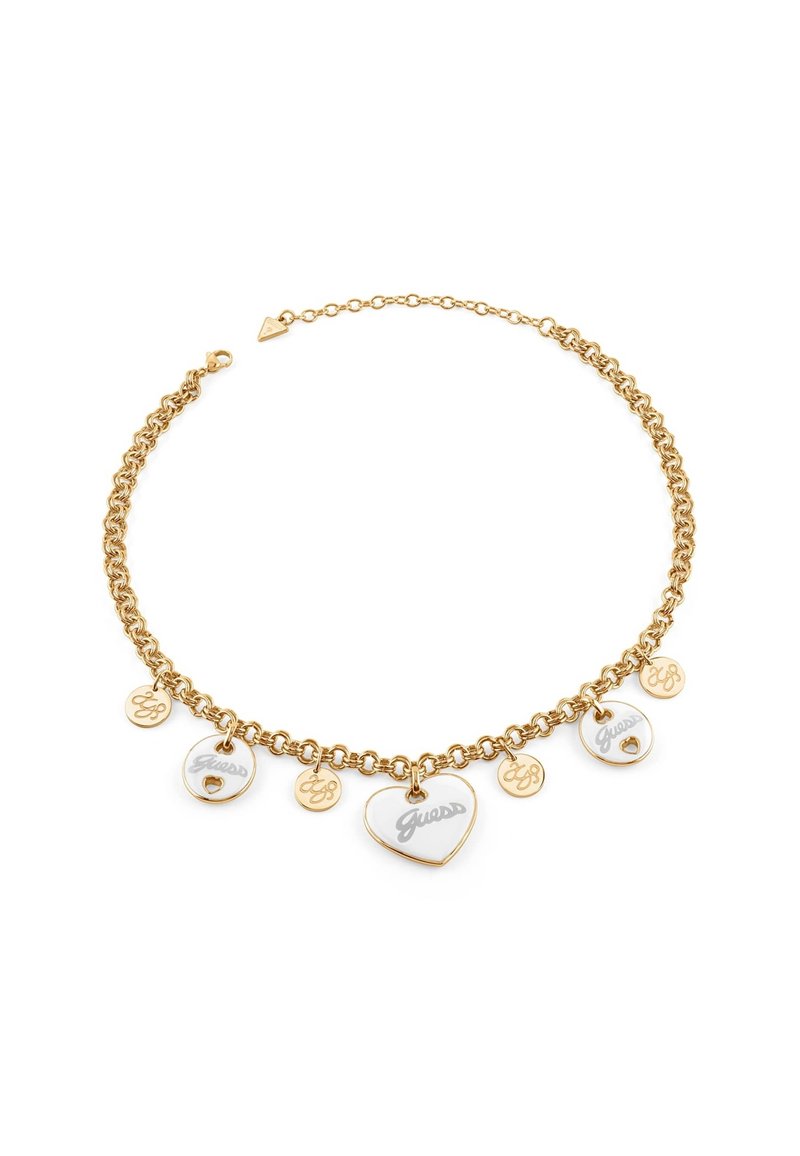 Gold-tone chain necklace featuring multiple charms, including two enamel hearts and circular tags engraved with "Guess" and logos.
