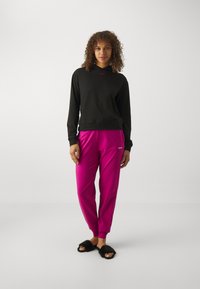 HUGO SHUFFLE - Donji dijelovi trenirke - dark pink