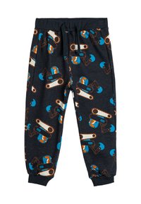Mørkegrå pyjamabukser med et gentaget mønster af orange og blå byggeudstyr. Elastisk talje med snor. Blødt stof.