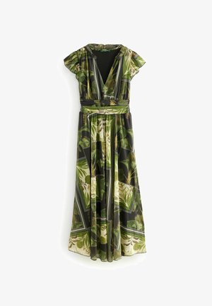 Maximimekko syvällä V-kaula-aukolla, liehuvalla helmalla ja lyhyillä leijailevilla hihoilla. Ominaisuutena vihreä trooppinen lehtikuvio mustalla taustalla.