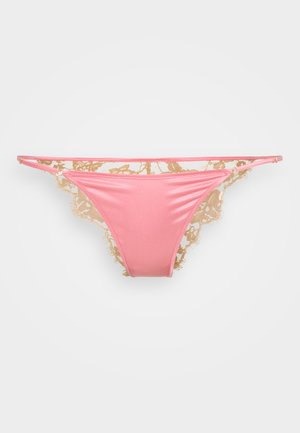 Pink satin thong with beige lace trim, featuring floral patterns, narrow straps, and scalloped edges. Smooth texture, minimalist design.