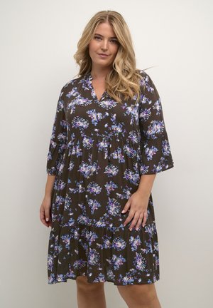 Brown floral dress with three-quarter bell sleeves, a v-neckline, and a tiered skirt. Features multicolored floral patterns throughout.