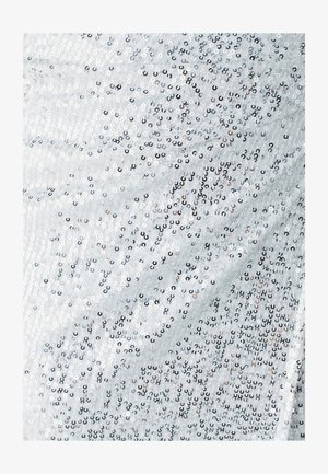 White fabric with a textured surface, densely covered in silver and black sequins, creating a shimmering effect with a smooth finish.