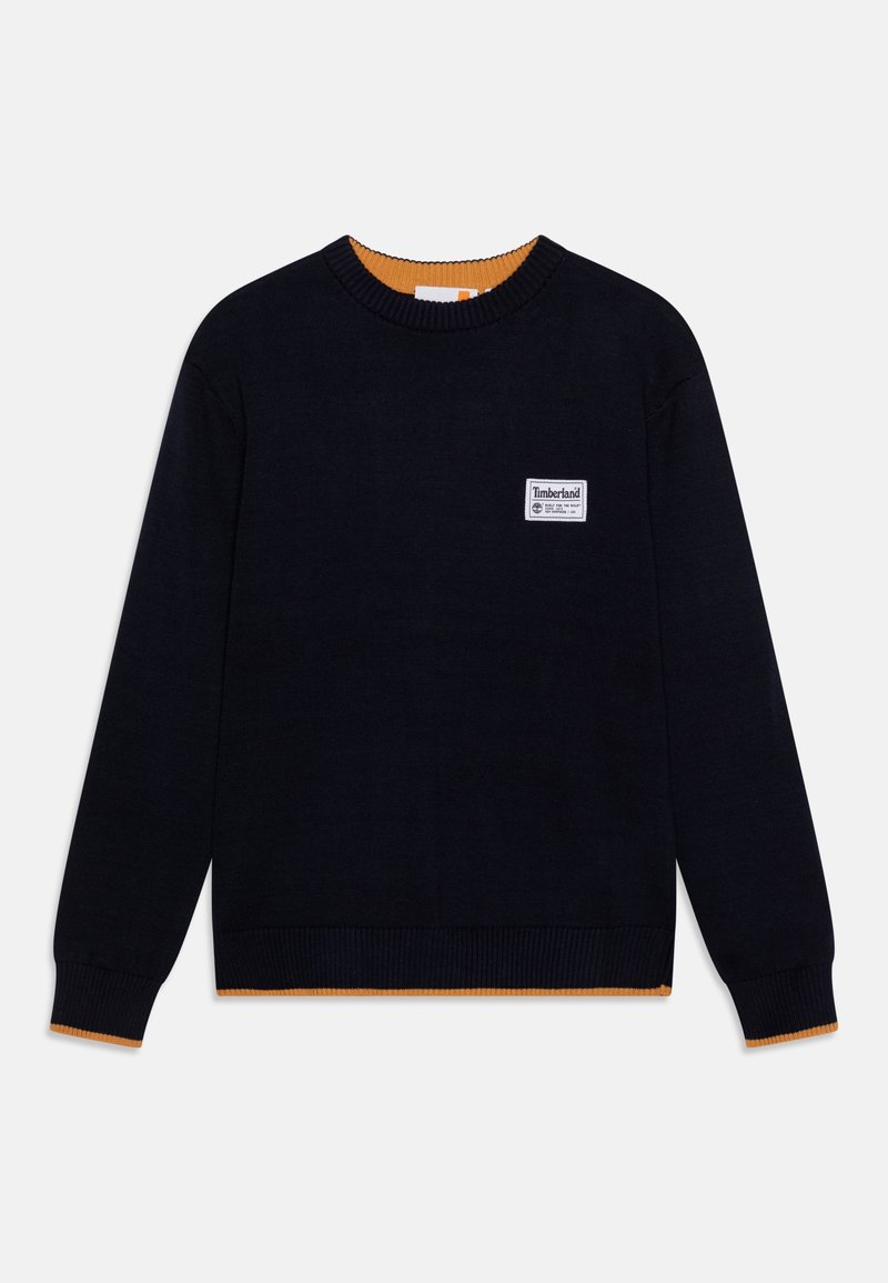 Pull noir col rond avec détails orange à l’intérieur du col et des poignets, manches longues et petit écusson logo Timberland blanc sur la poitrine.