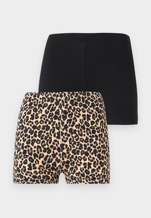 Deux paires de shorts ajustés, une noire unie et une avec un motif léopard beige et noir, présentées de face sur un fond uni.