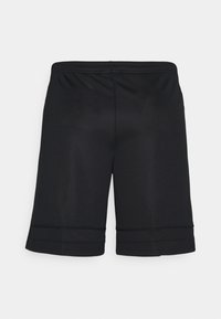 Short de sport noir longueur genou avec une ceinture élastique et des détails subtils de coutures horizontales près de l'ourlet.