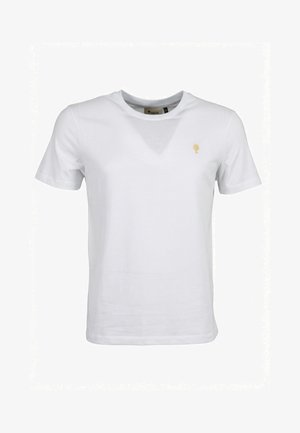 T-shirt bianca a maniche corte con scollo tondo e piccolo logo ad albero dorato sul petto a sinistra.