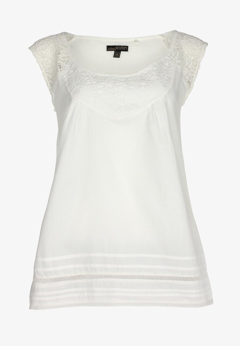 Blouse blanche sans manches avec manches courtes en dentelle, empiècement brodé de fleurs et détail transparent à rayures horizontales à l'ourlet.