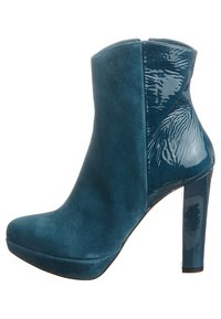 Teal ankle boot featuring a mix of matte suede and glossy patent materials, with a slender high heel and rounded toe design.