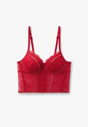 Bralette en dentelle rouge avec bonnets à armatures, tissu transparent, bretelles ajustables et motif floral, présentant un design structuré et ajusté.