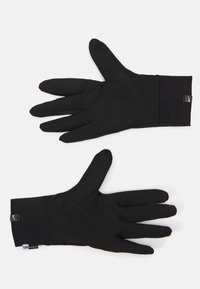 Black gloves made from soft, stretchable material, featuring a snug fit with a ribbed cuff and slim, curved fingers.