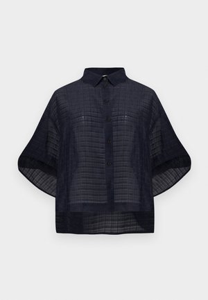 Κοντομάνικο πουκάμισο σε ναυτικό μπλε χρώμα με διακριτικό καρό σχέδιο και μυτερό γιακά.