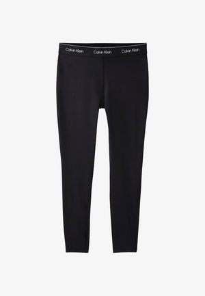 Schwarze enganliegende Leggings mit einem Calvin Klein markierten Bund, gefertigt aus glattem, elastischem Stoff, gezeigt vor einem schlichten weißen Hintergrund.
