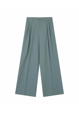 Pantalons larges vert clair en tissu lisse ; dotés de plis avant, de deux poches latérales et d'une taille cintrée.