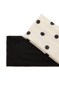 Zestaw dwóch opasek na głowę: jedna w kolorze czarnym, druga kremowa z granatowymi kropkami. Obie wykonane z miękkiego, elastycznego materiału.