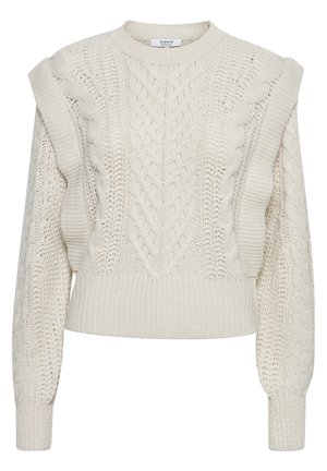 Pull en tricot crème avec un design en mailles torsadées, épaules surdimensionnées et poignets côtelés. Fini texturé et longueur courte.