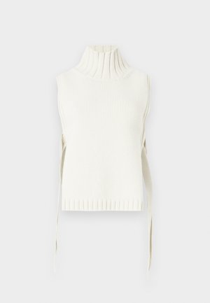 Haut sans manches à col roulé blanc, avec texture côtelée et liens latéraux. Il possède un col haut et une silhouette ajustée avec un ourlet côtelé.