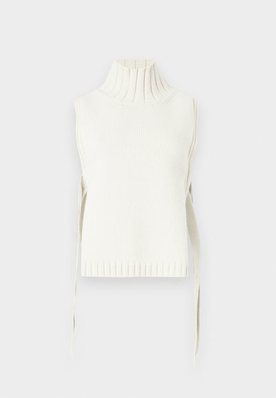 Αμάνικο τοπ με λαιμόκοψη ζιβάγκο σε άσπρο χρώμα, με ριμπ υφή και δεσίματα στο πλάι. Διαθέτει ψηλό γιακά και εφαρμοστή σιλουέτα με ριμπ τελείωμα.