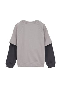 Felpa grigia e nera con vestibilità rilassata, maniche raglan e polsini a costine. Texture liscia, design minimalista e senza loghi visibili.