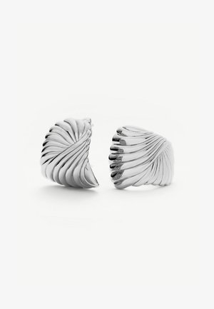 Pair of polished silver earrings with a twisted, ribbed shell-like design on a white background.