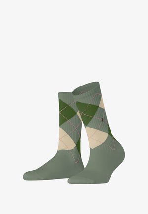Green and beige argyle patterned socks with ribbed texture, accented by pink stitching. Mid-calf length with a smooth finish.