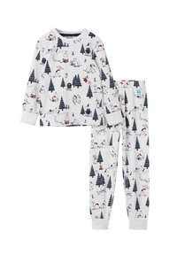 White pajama set featuring long-sleeved top and pants. Material is soft with a playful print of trees and whimsical characters in navy and red.
