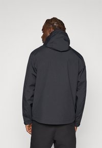 Black waterproof jacket featuring a hood, soft texture, and adjustable cuffs. Back view shows a simple, functional design without embellishments.