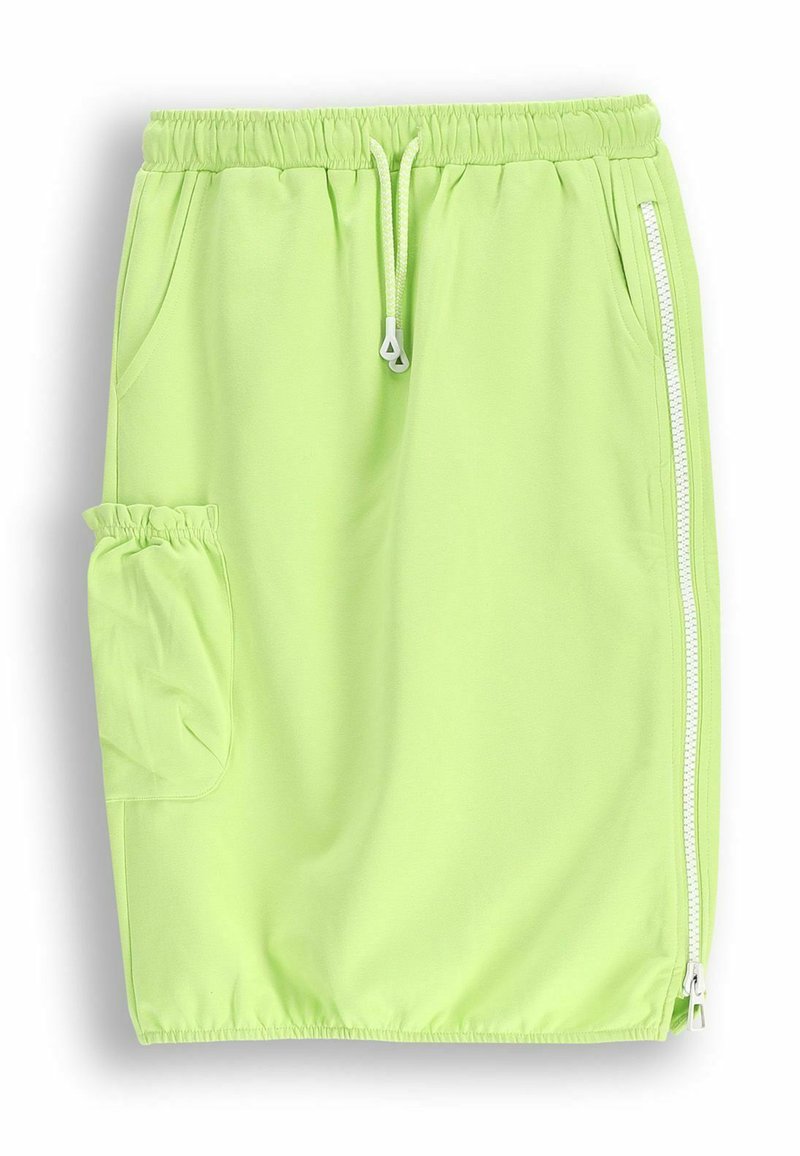Jasnozielona spódniczka sportowa uszyta z miękkiego, elastycznego materiału. Wyposażona w elastyczny pas, sznurek, boczny zamek błyskawiczny oraz boczną kieszeń.