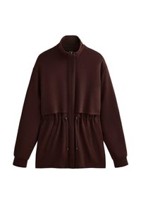 Bruine hooded jacket met een ritssluiting, elastische koord aan de taille en twee voorzakken. Gemaakt van een zachte, gestructureerde stof.
