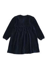 Eine marineblaue Cordkleid mit langen Ärmeln, gerafftem Taillenteil und glatter Textur; die Rückansicht zeigt einen einfachen runden Ausschnitt und einen fließenden Schnitt.