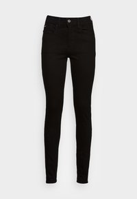Jeans skinny ajustados de color negro con botón frontal y bolsillos, exhibidos sobre un fondo claro y liso.