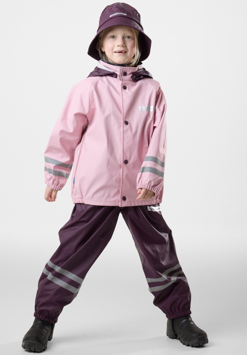 Waterproof rain set featuring a pink jacket with reflective strips and a purple pair of pants. Includes a matching purple bucket hat.