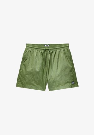 Green above-the-knee shorts made of lightweight, textured fabric, featuring an elastic waistband with drawstring and side seam pockets.