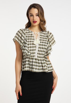 Let bæres kortærmet bluse med diamantmønster i creme, sort og guld. Den har en snørelukning i halsen med frynser og en peplum-silhuet.