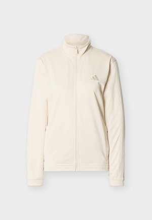 Kreemivärviline lukuga jope kõrge kraega, pikkade varrukatega, küljetaskutega ja peene Adidas logoga vasakul rinnal.