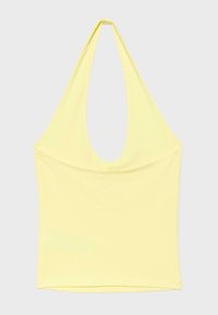 Haut jaune sans manches à col licou avec un décolleté profond en U et une silhouette ajustée sur un fond uni.