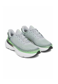 Zapatillas deportivas grises con parte superior de punto texturizado, destacadas por acentos en verde neón y una suela blanca acolchada. Los cordones y los detalles del logo son visibles.