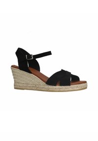Black suede wedge sandal with crisscross straps, ankle buckle, and jute-style braided rope detailing on the wedge heel.