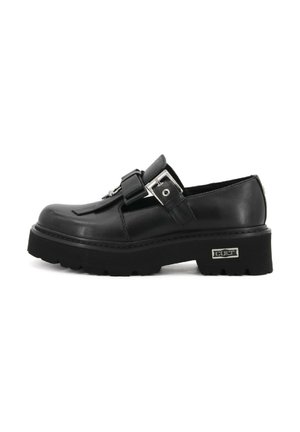 Scarpe in pelle nera con punta tondeggiante, cinturino regolabile con fibbia, suola in gomma spessa e superficie testurizzata. Presenta un accento di hardware in argento.