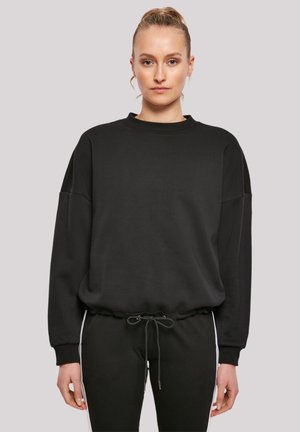 Black sweatshirt with a round neck, dropped shoulders, and elastic waistband. Smooth fabric with a relaxed fit; features a drawstring.