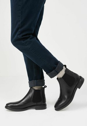 CLEATED - Classic ankle boots - black
