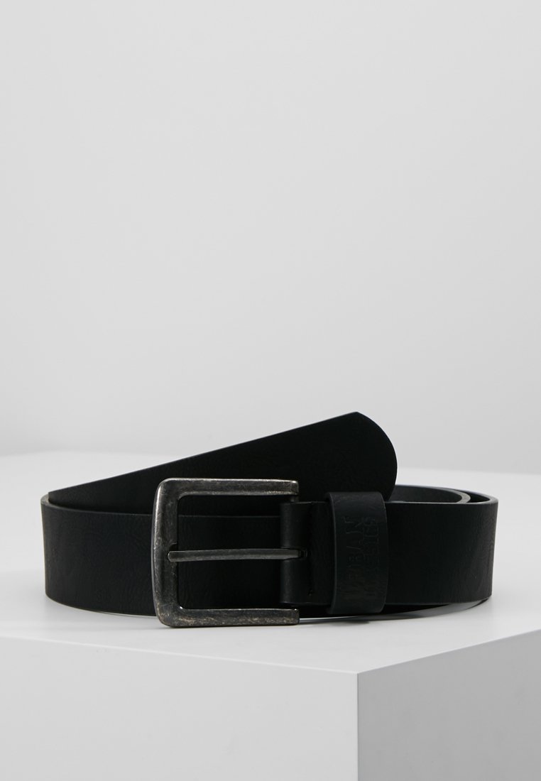 Black leather belt with a silver metal buckle, featuring a smooth texture and simple design, laid flat on a neutral background.