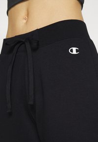 Champion BASIC CUFF PANTS - Träningsbyxor - black