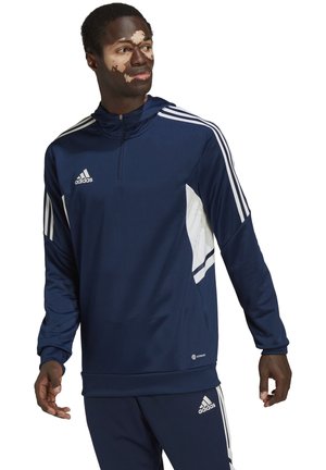 Marineblauwe Adidas pullover met kwart-rits, witte zijpanelen en drie witte strepen op de mouwen. Glad materiaal, comfortabele pasvorm, sportief ontwerp.