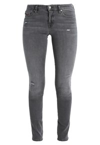 Jeans ajustados de denim gris oscuro con detalles desgastados. Cuenta con un diseño clásico de cinco bolsillos y herrajes metálicos en la cintura.