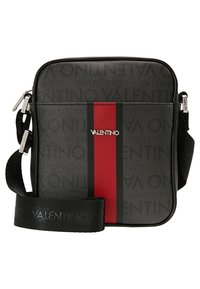 Black synthetic crossbody bag with red and black striped accent, embossed logo detailing, adjustable strap, and silver-tone hardware.