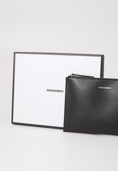 Black leather zip pouch with DSQUARED2 logo, presented in a white box with black trim. Smooth texture, sleek design, compact shape.