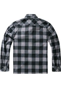 Camicia di flanella a quadri neri e grigi con maniche lunghe, polsini con bottoni e colletto. Texture morbida e motivo a scacchi su tutta la superficie.