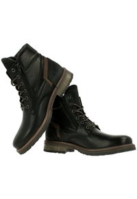 Stivaletti neri in pelle con una finitura strutturata, dettagli in marrone a contrasto, chiusura con lacci davanti, zip laterale e una suola in gomma resistente.